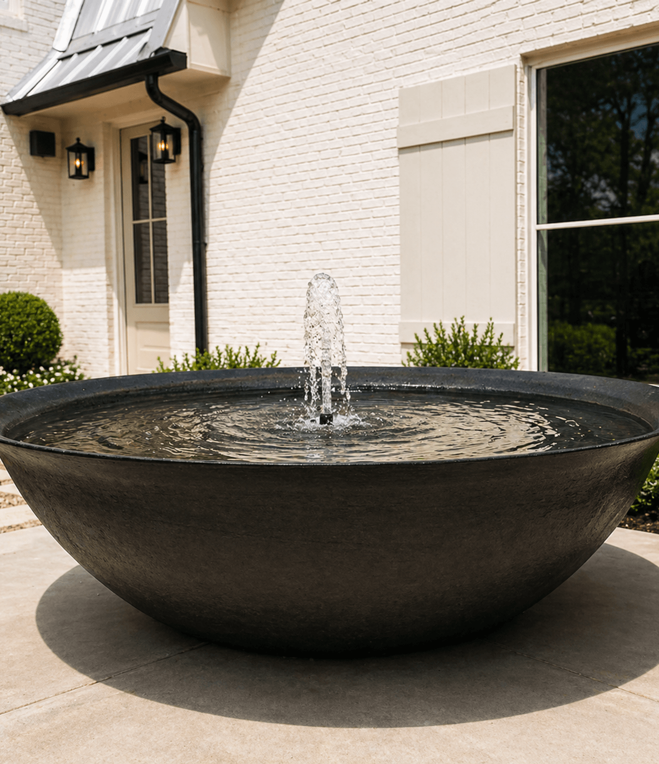 Bowl fountain in an entry courtyard, built by Strong Landscaping in Spring Branch, Houston, TX