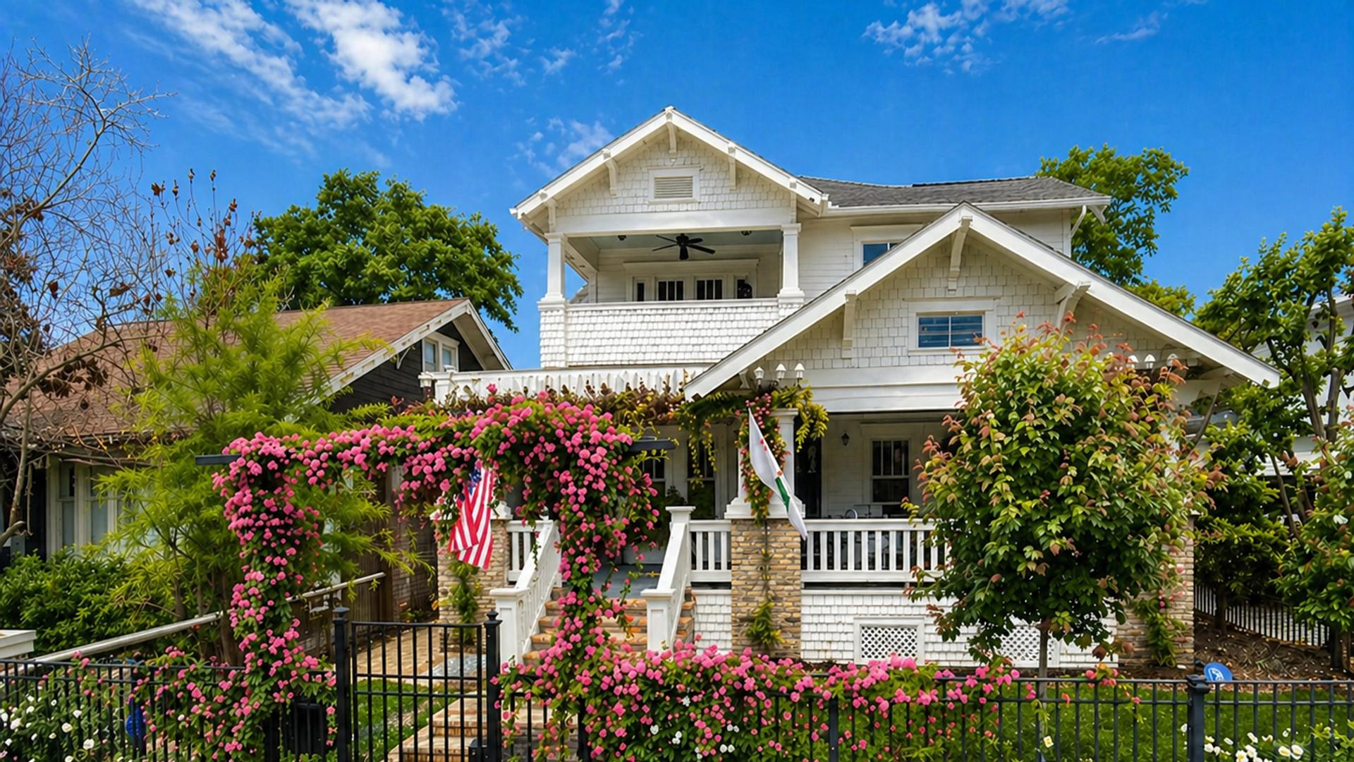 Designed front-yard rose garden with an entry gate and layered flower beds